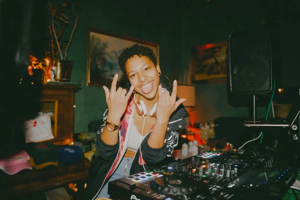 DJ Mahay behind her laptop and mixer